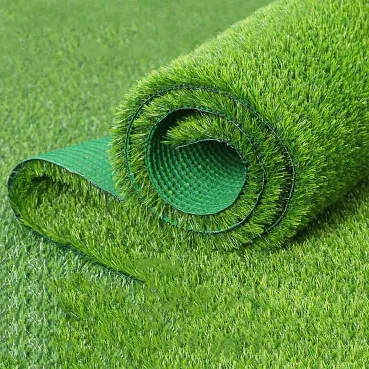 Artificial grass in a small landscaped corner Artificial grass in a small landscaped corner