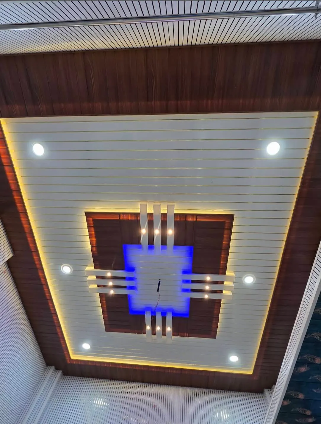 PVC ceiling panels being fitted plank by plank PVC ceiling panels being fitted plank by plank