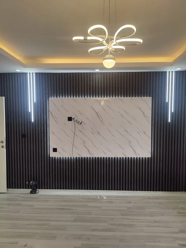 Living-room TV unit with a panelled back wall Living-room TV unit with a panelled back wall
