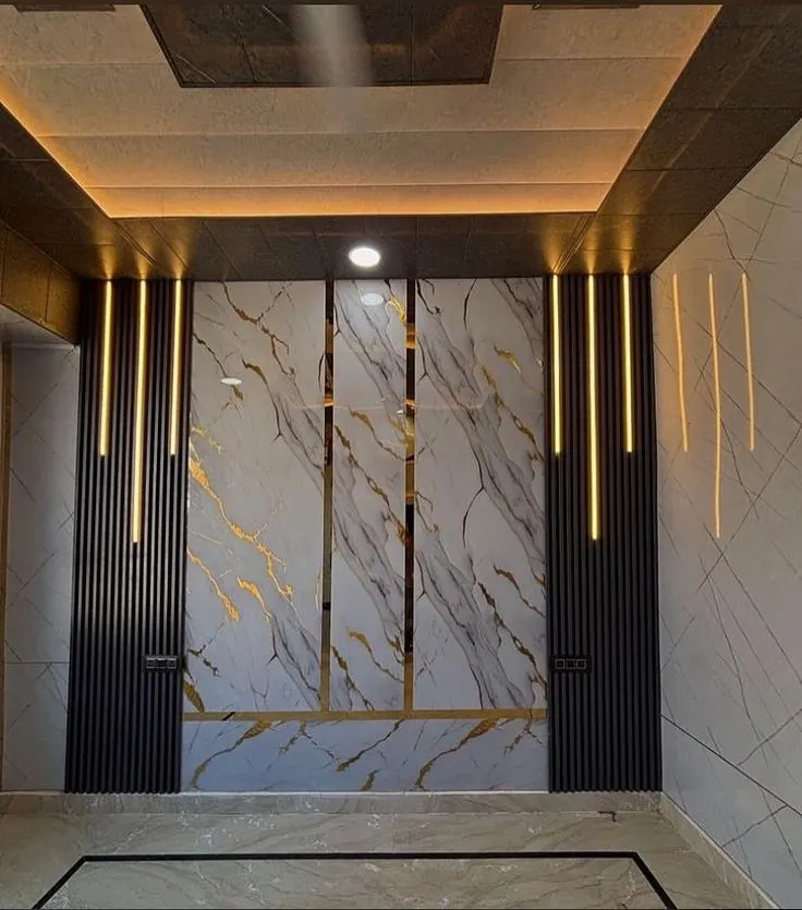 WPC fluted wall panel behind a TV, installed by JK Interior in Bihar